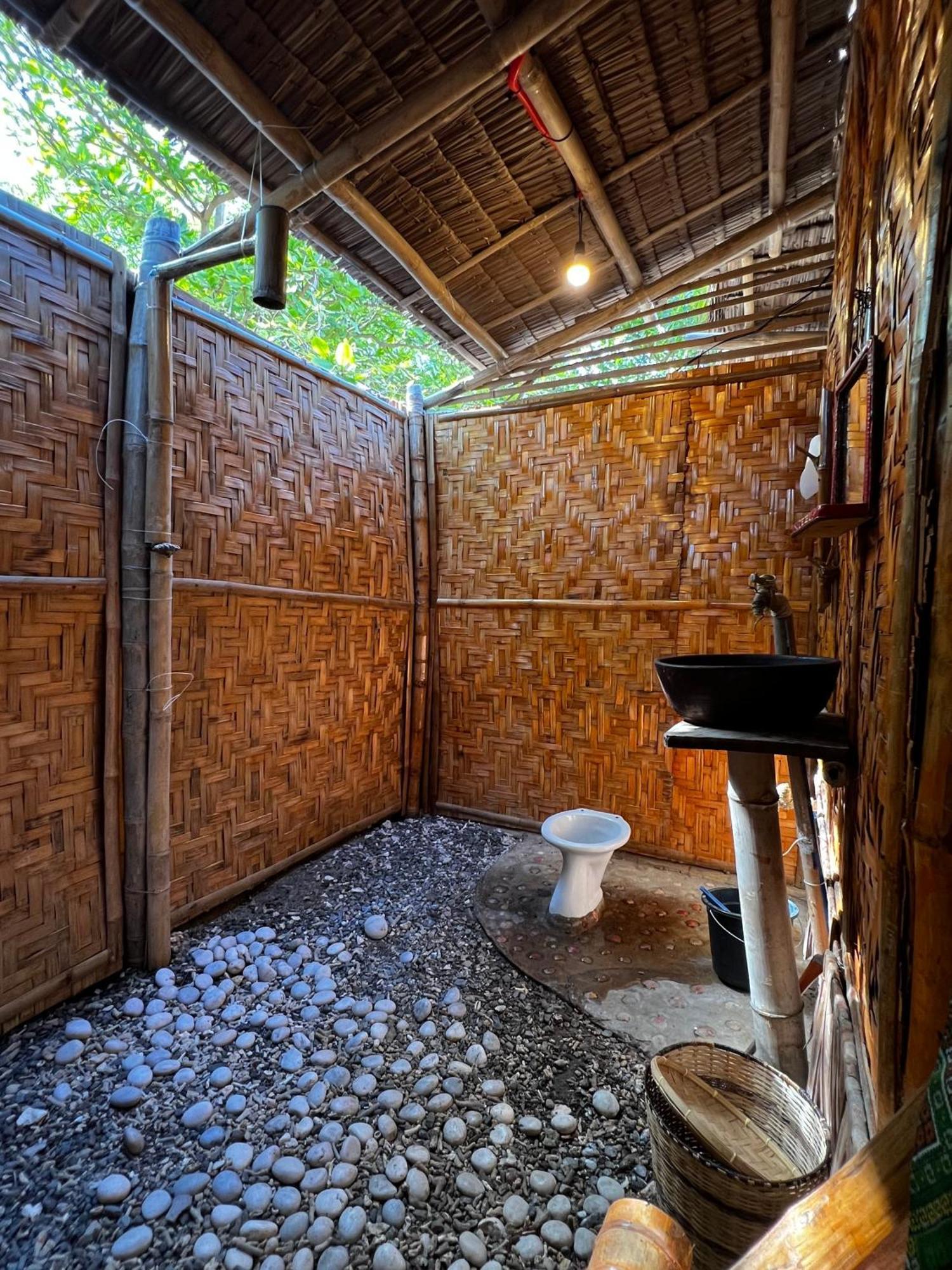 Tribal Huts Community Vandrarhem Daanbantayan Rum bild